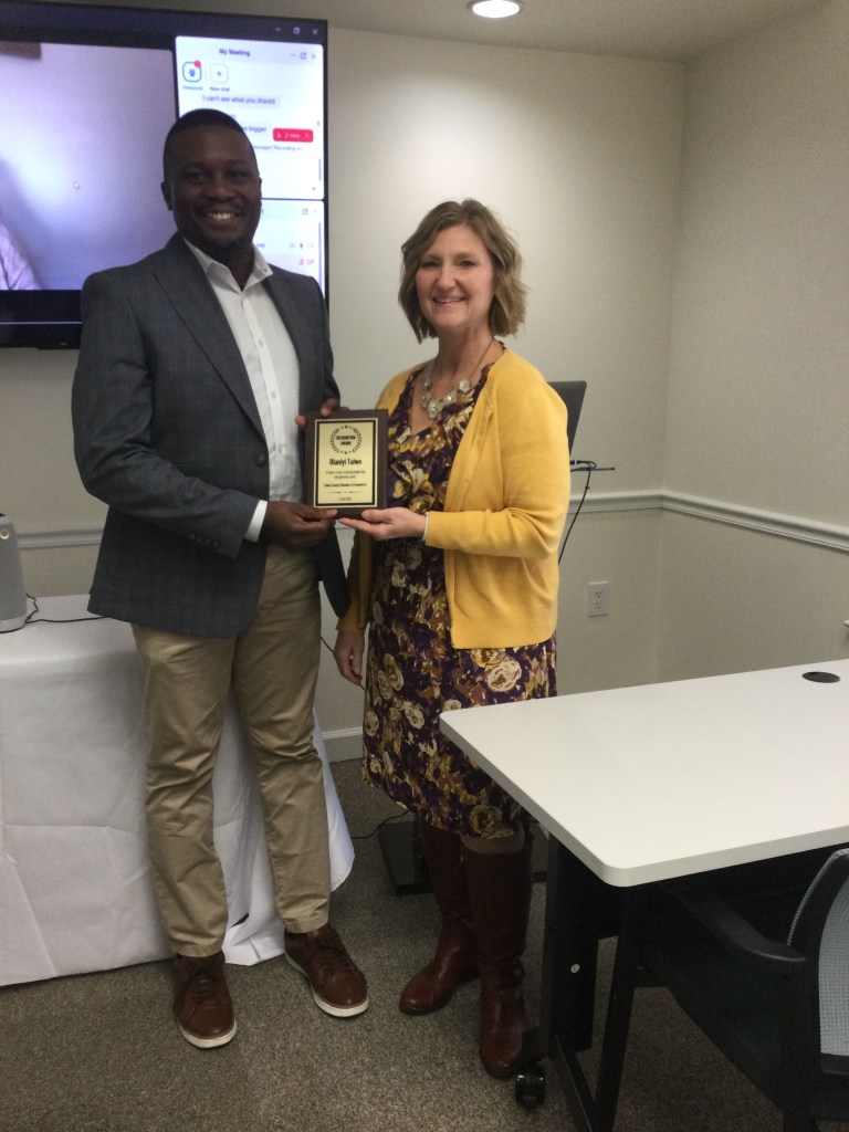 President of The Talbot County Chamber of Commerce, Ms. Amy Kreiner presenting an award to our Keynote Speaker, Olaniyi Taiwo.